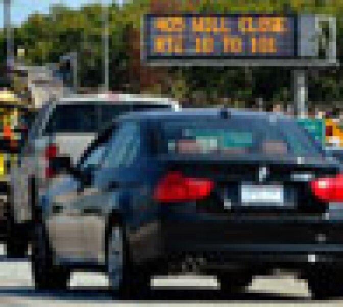 A traffic signs alerts motorists on Interstate 405 of the shutdown one day before workers start demolishing the Mulholland Bridge on Interstate 405 at the Sepulveda Pass during the 11-mile shutdown of Interstate 405 from July 16-18 for 53 hours on July 14, 2011 in Los Angeles. Los Angeles city officials are advising residents to stay home or stay away from the area over the weekend fearing massive traffic jams of what has become known as 'Carmageddon.'