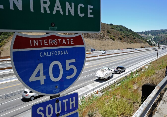 LOS ANGELES, CA - JULY 17: Light traffic flows on the Interstate 405 after it re-opened ahead of schedule following the10 mile shutdown of the nation's busiest freeway for bridge work the Mulholland bridge on July 17, 2011 in Los Angeles, California. Los Angeles city officials advised residents to stay home or stay away from the area over the weekend fearing massive traffic jams of what has become known as ''Carmageddon.'' which never materialized. (Photo by Kevork Djansezian/Getty Images)