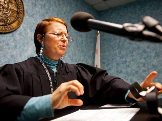 Elizabeth Oakes likes the wedding ring of a bride-to-be. Oakes got married at the LA County office herself, and is part of a cadre of volunteers who help couples get hitched.