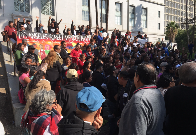 Street vendors and their advocates celebrate outside L.A. City Hall on Wednesday, Nov. 28 after the City Council unanimously approved a plan to legalize street vending and let vendors take out permits.
