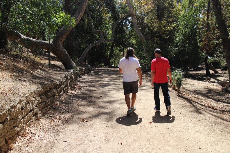 Chuck McCarthy and A Martinez walk and talk in Griffith Park.