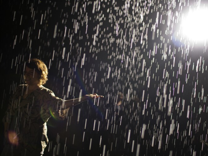 Press preview attendees walk through the Rain Room at LACMA on Wednesday morning, Oct. 28, 2015. The installation uses about 528 gallons of water within a self-contained system. The same 528 gallons will be recycled throughout the entire run of the exhibition.