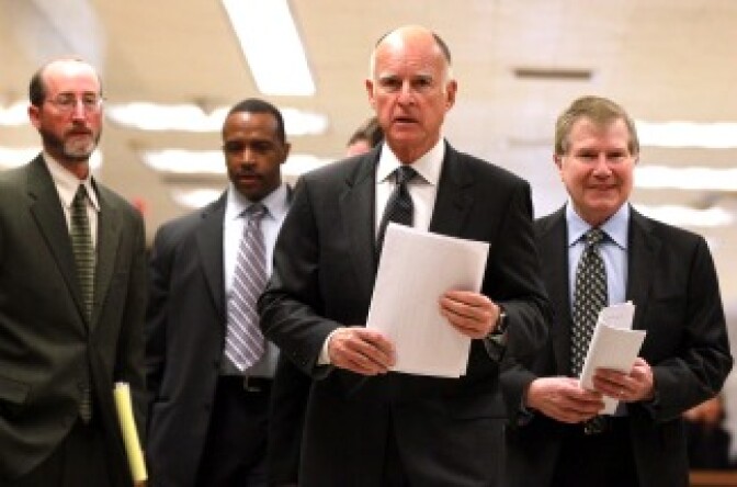 Gov. Jerry Brown walks with advisors to a press conference about his proposed budget at the California State Capitol on Jan. 10, 2011 in Sacramento.