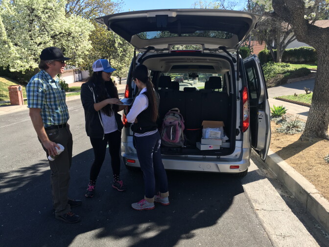 An independent, volunteer research team, led by Michael Jerrett, chair of Environmental Health Sciences at UCLA's School of Pubic Health checks on air samples at a home in Porter Ranch on Feb. 11, 2016. From left to right: Jerrett, UC Berkeley PhD student, Diane Garcia-Gonzales and Peking University PhD student, Helene Wang.