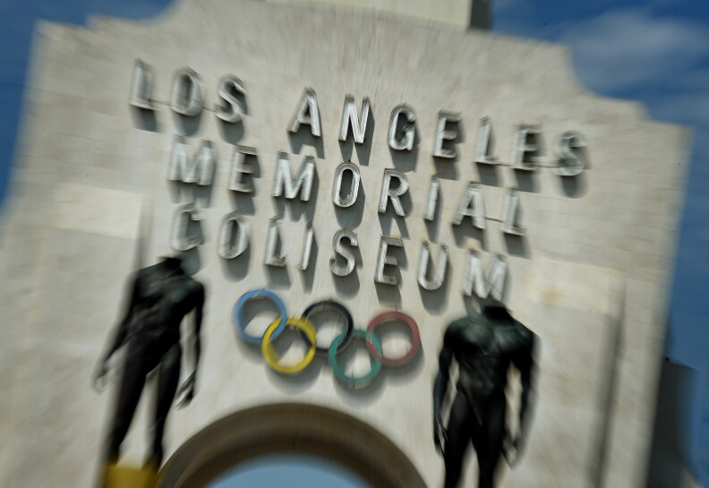 The Los Angeles Memorial Coliseum, venue for two previous Olympic Games, is seen in this on August 26, 2015 in Los Angeles, California. The Coliseum would be renovated and used as the main stadium if the city bids for the 2024 Summer Olympics. The Los Angeles city council is reviewing a $4.1 billion bid proposal for the 2024 Summer Olympics that backers say could produce a surplus of $161 million if the city is awarded a third Summer Games. A 218-page bid book made public on August 25 shows plans for a Los Angeles Games rely on private-sector partners to pay more than $1.7 billion in venue costs and includes revenue projections such as $4.8 billion from ticket sales, broadcast rights and corporate sponsorships.       AFP PHOTO / MARK RALSTON        (Photo credit should read MARK RALSTON/AFP/Getty Images)