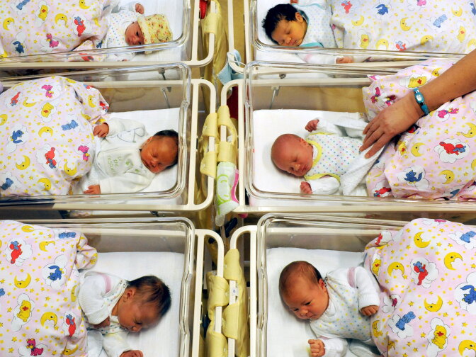 Newborn babies lay in their beds at the St. Elisabeth and St. Barbara hospital in Halle, eastern Germany, on January 2, 2012. In the year 2011, 1863 babies were born at the hospital. 