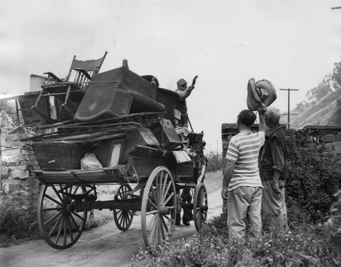 May 14, 1951: "New projected housing project is forcing many oldtimers like Julian, on wagon, to move from Chavez Ravine to new quarters. Later the area became part of the baseball stadium of the Los Angeles Dodgers instead." Courtesy of the Los Angeles Public Library
