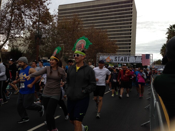 Runners wear Thanksgiving-themed hats and costumes to Turkey Trot LA, Nov. 28, 2013.