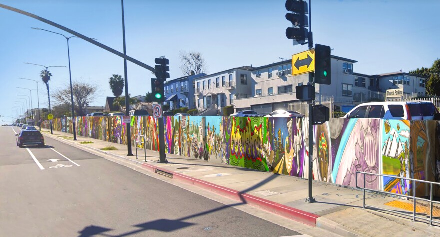 A digital mockup of a wall along a street covered in murals.