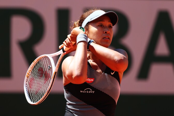 PARIS, FRANCE - MAY 30: Naomi Osaka of Japan plays a backhand in her First Round match against Patricia Maria Tig of Romania during Day One of the 2021 French Open at Roland Garros on May 30, 2021 in Paris, France. (Photo by Julian Finney/Getty Images)