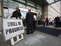 UCLA health workers attend to a mock patient during an Ebola response exercise on Friday, Oct. 17, at the Ronald Reagan UCLA Medical Center.
