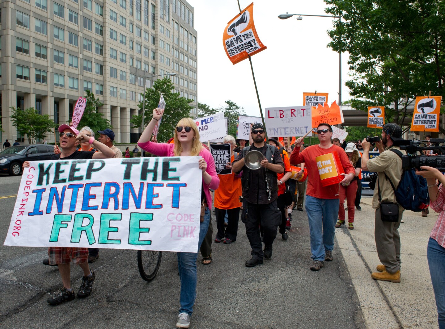 Protesters hold a rally to support 'net neutrality' and urge the Federal Communications Commission (FCC) to reject a proposal that would allow Internet service providers such as AT&T and Verizon 'to boost their revenue by creating speedy online lanes for deep-pocketed websites and applications and slowing down everyone else,' on May 15, 2014 at the FCC in Washington, DC. 