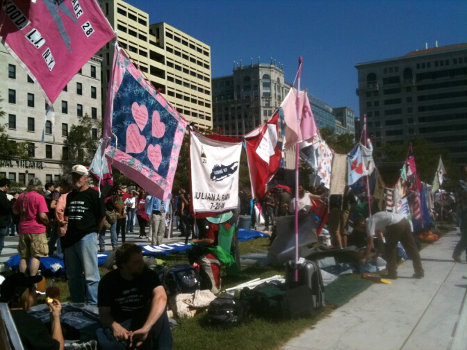 Protesters hang banners and set up camp at the Occupy Wall Street event in Washington, D.C. on October 6, 2011