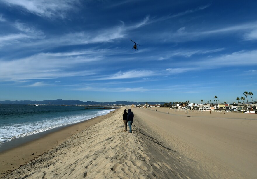 A sand berm created by city workers to protect houses from El Nino storms and high tides is seen at Playa Del Rey beach in Los Angeles, California on November 30, 2015 at the start of the COP21 conference in Paris. Some 150 leaders, including US President Barack Obama, China's Xi Jinping, India's Narendra Modi and Russian President Vladimir Putin, will attend the start of the Paris conference, which is tasked with reaching the first truly universal climate pact, with the goal to limit average global warming to two degrees Celsius (3.6 degrees Fahrenheit), perhaps less, over pre-Industrial Revolution levels by curbing fossil fuel emissions blamed for climate change.       AFP PHOTO / MARK RALSTON / AFP / MARK RALSTON        (Photo credit should read MARK RALSTON/AFP/Getty Images)