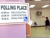 LOS ANGELES, UNITED STATES: A poster designating a polling station at a school in East Los Angeles,CA, 07 November, 2000, is written in seven languages. Twelve million people are expected to vote in California for the 54 electoral votes to elect the President of the United States. Californians are also voting for Legislative, Federal and State officials and eight state ballot initiatives. 