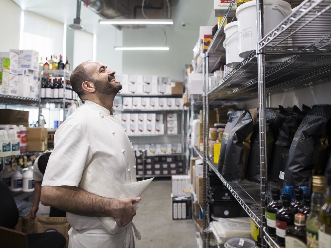 Executive Chef Vartan Abgaryan stands in the dry storage room for 71 Above, the new restaurant on the 71st floor of the U.S. Bank Tower in downtown Los Angeles, on Thursday afternoon, Sept. 22, 2016.