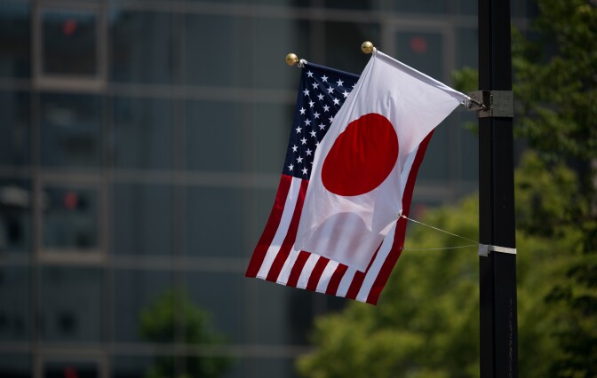 CORRECTION - A Japanese and a US flag are seen next to the Hiroshima Peace Memorial in Hiroshima on May 27, 2016.
US President Barack Obama was to make history later on May 27 when he travels to Hiroshima -- becoming the first sitting US leader to visit the site that ushered in the age of nuclear conflict. / AFP / JOHANNES EISELE / The erroneous mention[s] appearing in the metadata of this photo by JOHANNES EISELE has been modified in AFP systems in the following manner: [2016] instead of [2017]. Please immediately remove the erroneous mention[s] from all your online services and delete it (them) from your servers. If you have been authorized by AFP to distribute it (them) to third parties, please ensure that the same actions are carried out by them. Failure to promptly comply with these instructions will entail liability on your part for any continued or post notification usage. Therefore we thank you very much for all your attention and prompt action. We are sorry for the inconvenience this notification may cause and remain at your disposal for any further information you may require.        (Photo credit should read JOHANNES EISELE/AFP/Getty Images)