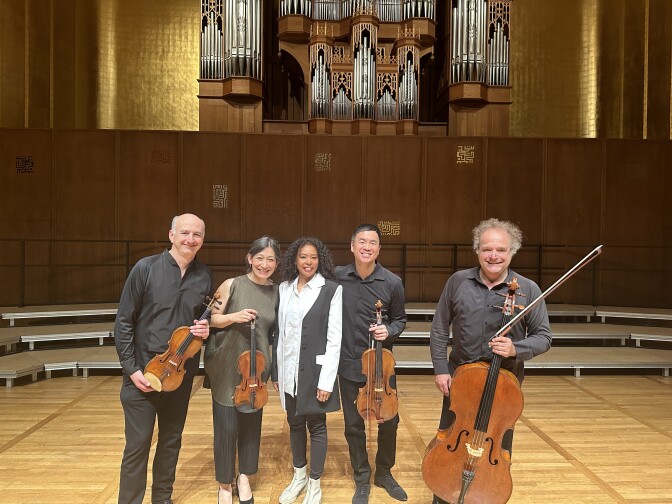 The Takács Quartet — left to right: Edward Dusinberre, Harumi Rhodes, Richard O'Neill and András Fejér — collaborated with composer Nokuthula Ngwenyama (center) to premiere her composition "Flow."
