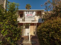 Signs of protest at 1659 Rodney Drive, where tenants are seeking to avoid an Ellis Act eviction.