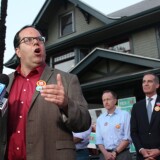 United Teachers Los Angeles president Alex Caputo-Pearl (left) speaks at a gathering of Measure EE supporters after polls close on Tuesday evening, June 4, 2019, as L.A. Unified School District Superintendent Austin Beutner (center, at back) and L.A. Mayor Eric Garcetti (right) look on