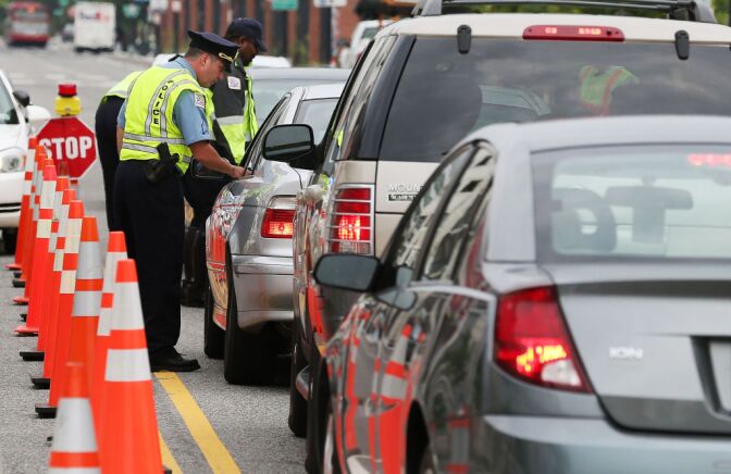 Washington Metropolitan Police conduct a sobriety check point associated with a news conference on drunk driving, on August 14, 2012 in Washington, DC. The National Highway Traffic Safety Administration (NHTSA) held a news conference to discuss the national anti-drunk driving campaign and law enforcement crackdown. 