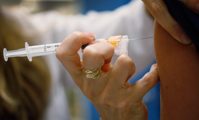 MIAMI, FL - SEPTEMBER 21:  University of Miami pediatrician, Judith L. Schaechter, M.D., gives an HPV vaccination to a 13-year-old girl in her office at the Miller School of Medicine on September 21, 2011 in Miami, Florida. The vaccine for human papillomavirus, or HPV, is given to prevent a sexually transmitted infection that can cause cancer. Recently the issue of the vaccination came up during the Republican race for president when Rep. Michele Bachmann (R-MN) called the vaccine to prevent cervical cancer "dangerous" and said that it may cause mental retardation, but expert opinion in the medical field contradicts her claim. Texas Gov. Rick Perry, also a presidential contender, has taken heat from some within his party for presiding over a vaccination program in his home state. (Photo by Joe Raedle/Getty Images)