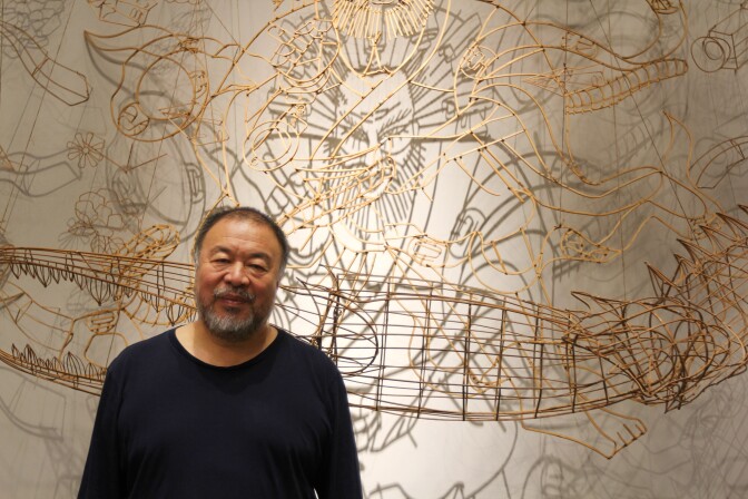 Chinese artist Ai Weiwei stands before a bamboo self-portrait at the Marciano Art Foundation in Los Angeles. "Ai Weiwei: Life Cycle" is open September 28, 2018–March 3, 2019. 
