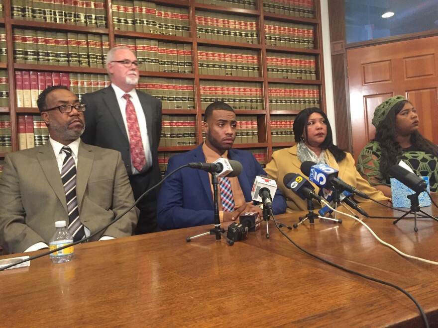 Christopher Ballew (center), says he was unfairly stopped and beaten by Pasadena police officers on November 9th, 2017. His family joined him at a press conference to announce a lawsuit against the City of Pasadena and the officers involved in his arrest. From left to right: father Anthony Ballew, Attorney John Burton, Christopher Ballew, mother Sonya Ballew, and sister Domonique Ballew.