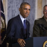 US President Barack Obama (L) speaks on the Orlando shooting at the Treasury Department while Chairman of the Joint Chiefs of Staff General Joseph Dunford (R) look on, on June 14, 2016.