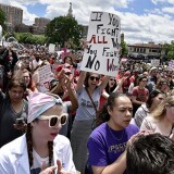 Several hundred spirited protestors marched through the Country Club Plaza Sunday, May 19, 2019, in response to the near-total abortion ban passed last week by Missouri legislators. The group then gathered at the J.C. Nichols fountain to hear speakers.