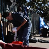 LOS ANGELES, CA - JANUARY 24:  Rene Conant, a homeless man, packs up his camp on January 24, 2017 in Los Angeles, California. According to a 2016 report by  the U.S. Department of Housing and Urban Development, Los Angeles has the highest number of homeless people in the nation with close to 13,000 living on the streets. The annual Greater Los Angeles Homeless Count begins today and will continue through Thursday.  (Photo by Justin Sullivan/Getty Images)