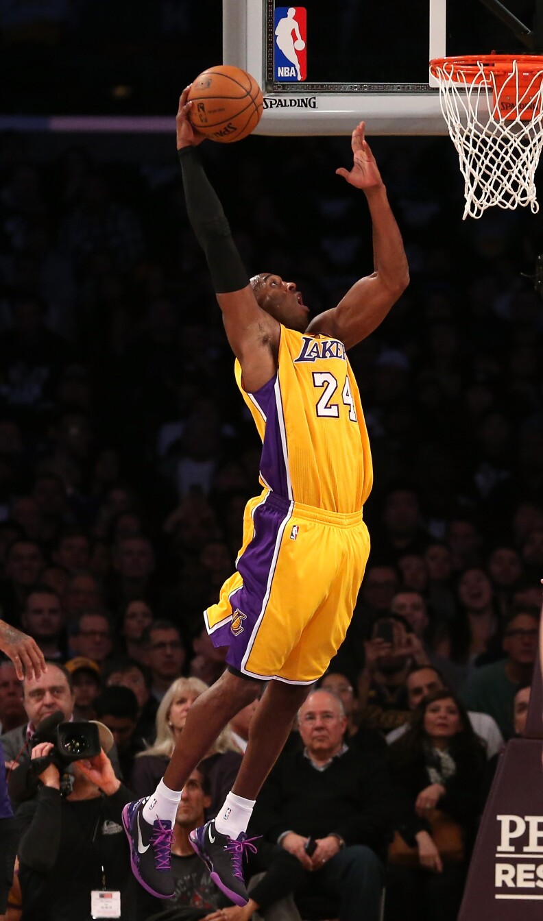 LOS ANGELES, CA - DECEMBER 10:  Kobe Bryant #24 of the Los Angeles Lakers scores a basket against the Phoenix Suns at Staples Center on December 10, 2013 in Los Angeles, California.  NOTE TO USER: User expressly acknowledges and agrees that, by downloading and or using this photograph, User is consenting to the terms and conditions of the Getty Images License Agreement.  (Photo by Stephen Dunn/Getty Images)