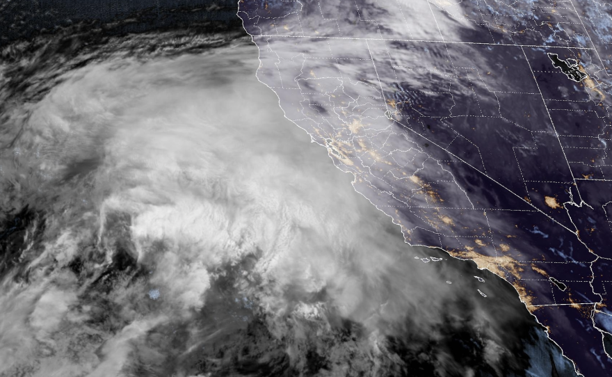 A massive storm is visible off the coast of California