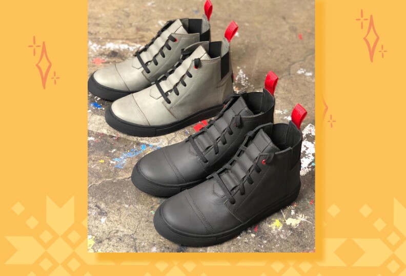 Two pair of lace up booth, one sliver and the other black, both have red on the back