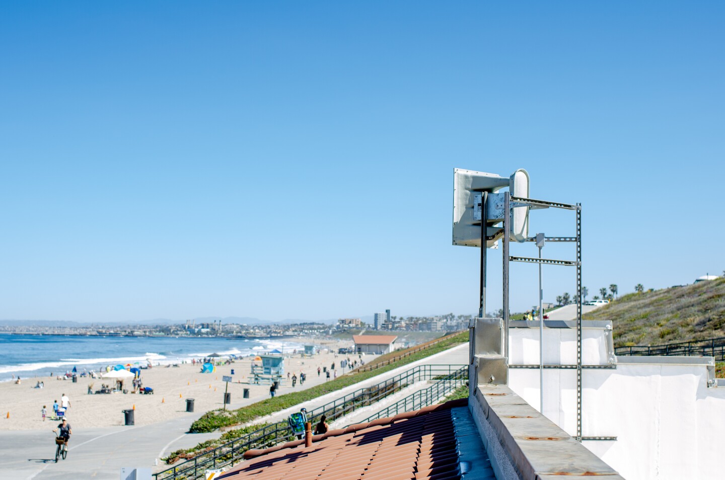 Loudspeakers mounted on a structure at Torrance Beach point toward the sand.