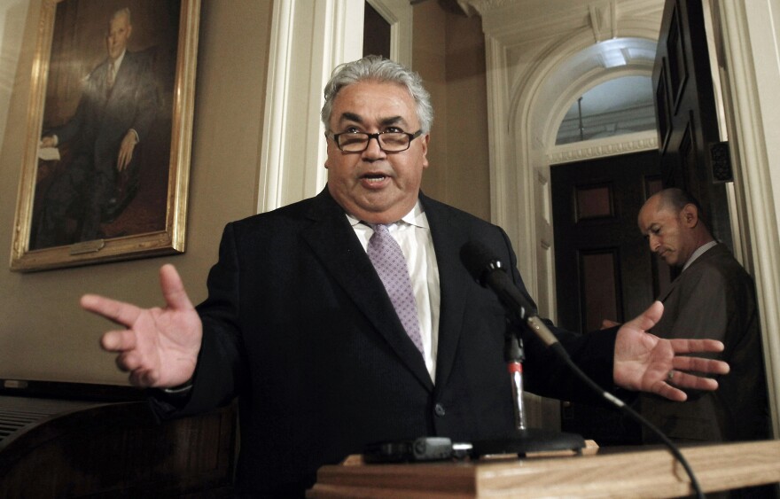 FILE - In this Monday June 10, 2013, file photo State Sen. Ron Calderon, D-Montebello, left, holds a brief news conference during first appearance at the Capitol since the FBI investigators raided his offices in Sacramento, Calif. Sen. Calderon was a no-show with an unexcused absence after at least a half-dozen FBI agents carted boxes from his Sacramento offices following a more than six-hour search in June 2013. Sen. Calderon did not answer any questions and no details have been given for the search and no charges have been filed. (AP Photo/Rich Pedroncelli, File)