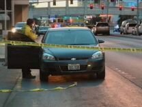 Police investigate the scene of a shooting between cars on the Las Vegas Strip early Thursday, Feb. 21, 2013 in Las Vegas. Gunshots fired from a black Range Rover on the Strip early Thursday caused a Maserati to crash into a taxi, creating a fireball and killing three people as the SUV sped away. It's the latest in a series of violent actions on the tourist corridor since the beginning of the year.