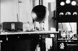 The LA Public Library's online photo archive gives us: "A view of early radio equipment, including the large speaker and the vacuum tubes (on the right)." We're hoping to build on these 1921 purchases with our pledge drive fundraising.