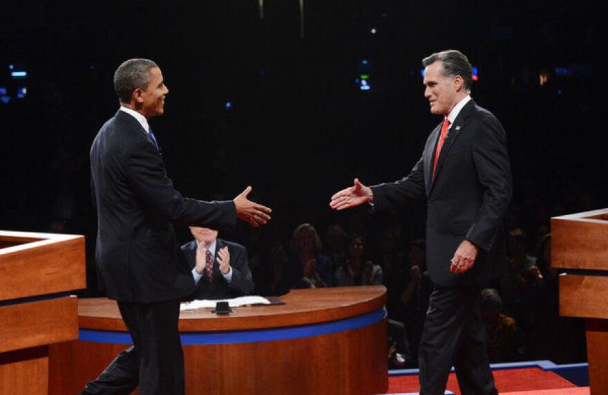 DENVER, CO - OCTOBER 03:  U.S. President Barack Obama (L) shakes hands with Republican presidential candidate and former Massachusetts Gov. Mitt Romney during the Presidential Debate at the University of Denver on October 3, 2012 in Denver, Colorado. 