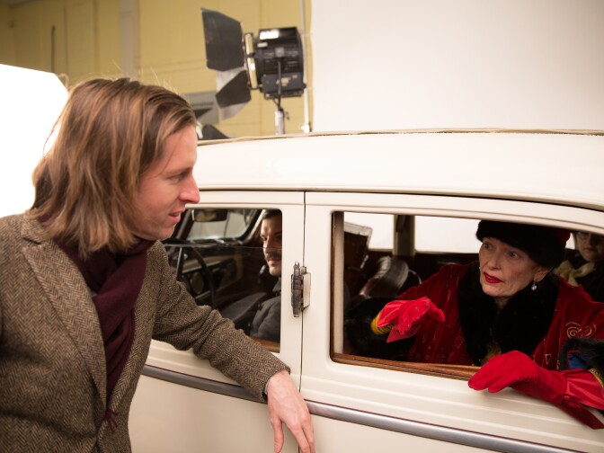 Director Wes Anderson speaks with actress Tilda Swinton on set of "The Grand Budapest Hotel."