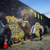LOS ANGELES, CALIFORNIA - FEBRUARY 13: A mural depicting deceased NBA star Kobe Bryant, painted by Jonas Never, is displayed on a building on February 13, 2020 in Los Angeles, California. Numerous murals depicting Bryant and Gianna have been created around greater Los Angeles following their tragic deaths in a helicopter crash which left a total of nine dead. A public memorial service honoring Bryant will be held February 24 at the Staples Center in Los Angeles, where Bryant played most of his career with the Los Angeles Lakers.  (Photo by Mario Tama/Getty Images)