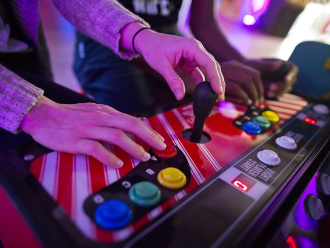 Nicole and husband Blake Bolton play Wind Jammers at Neon Retro Arcade in Pasadena on Wednesday afternoon, Feb. 4.