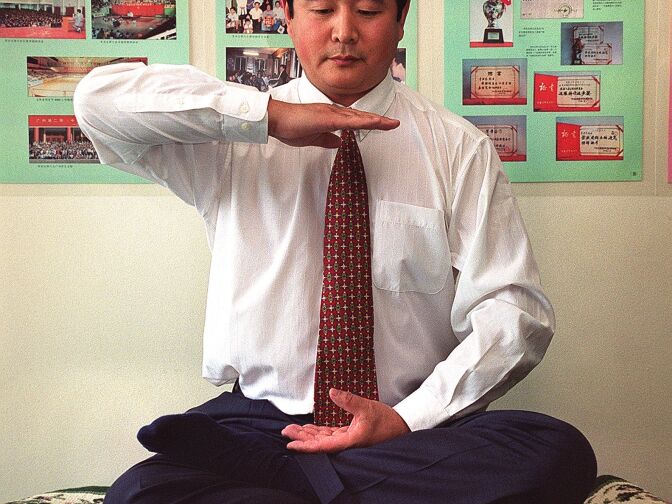 NEW YORK, NY - JUNE 15:  Falungong master Li Hongzhi, US-based leader of a popular meditation and martial arts sect, poses during an interview 15 June 1999 in New York. The group, claiming100 million followers, has drawn massive international attention since thousands of its members surrounded the Zhongnanhai leadership compound in Beijing in April.  (Photo credit should read HENNY ABRAMS/AFP/Getty Images)
