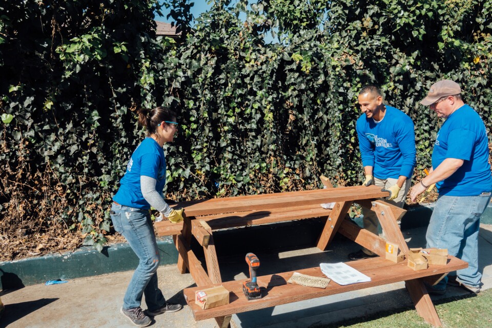 A picnic table comes together at Gonzaque Village in Watts during a volunteer event organized by The Mission Continues.