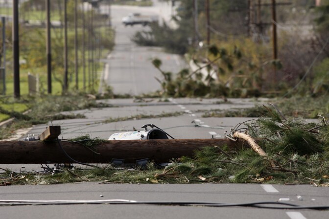 PASADENA, CA - DECEMBER 1:  Fallen power poles block a street as strong Santa Ana Winds cause the worst local wind damage in decades on December 1, 2011 in Pasadena, California. As many as 230,000 were without power and the city of Pasadena closed schools and declared a state of emergency. (Photo by David McNew/Getty Images)