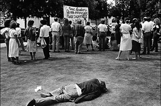 A homeless man sleeps in Gladys Park, 1984.