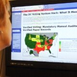 A woman reads information on the Verified Voting Federation website on October 20, 2010 in Washington, DC. 