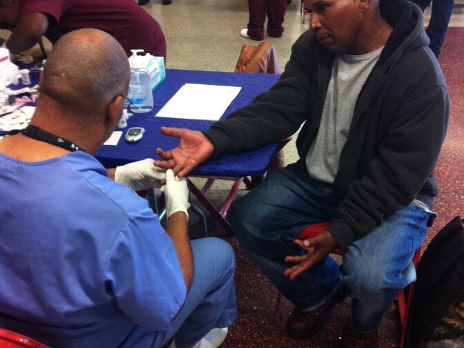 Marcus Mackbee, 51, said he lost his job due to a seizure and doesn't have insurance. He said he attended the free mobile clinic to check his vision and hopefully get glasses. 
