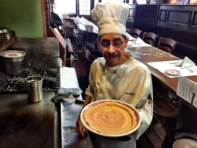 Domingo Pule (22 years at Musso & Frank) looks at the perfect flannel cake - which is a cross between a pancake and a crepe, and was named because it should be as thin as a piece of flannel.