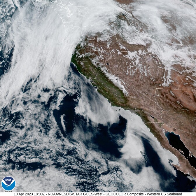 A satellite image shows dense cloud cover along the Southern California coast.